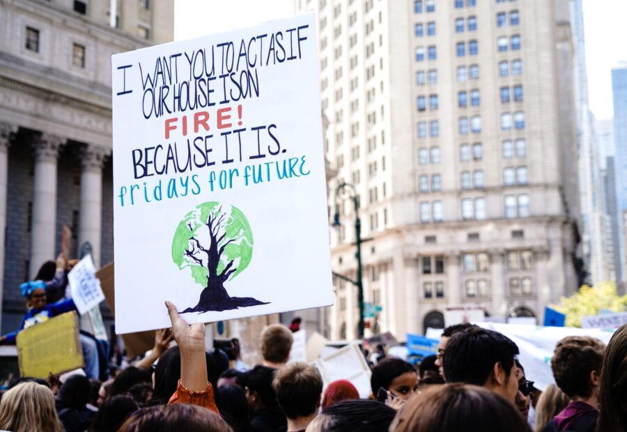 A protestor holds a sign at an environmental justice protest in NYC